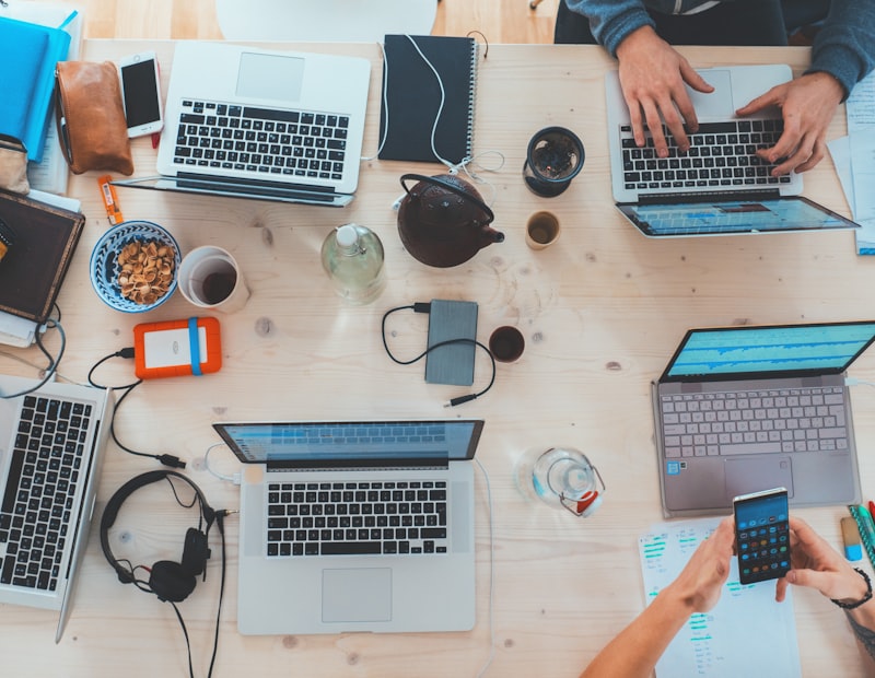 Modern desk with laptops and gadgets